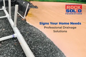 Signs of poor drainage causing water damage in a home.